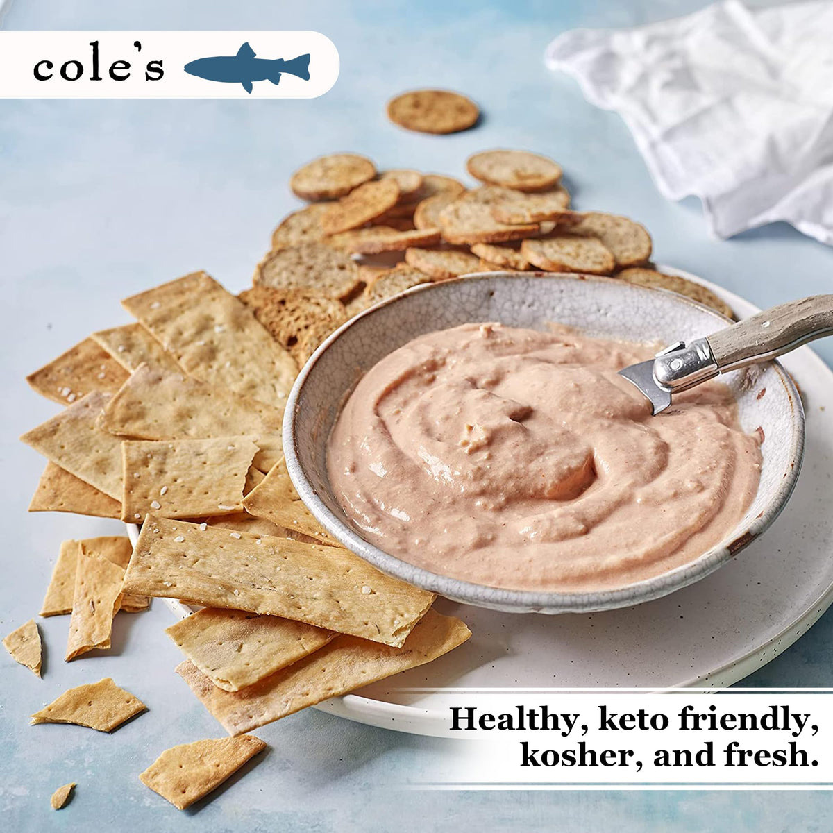 Cole's Snow Crab meat with dipping crackers, perfect for appetizers.