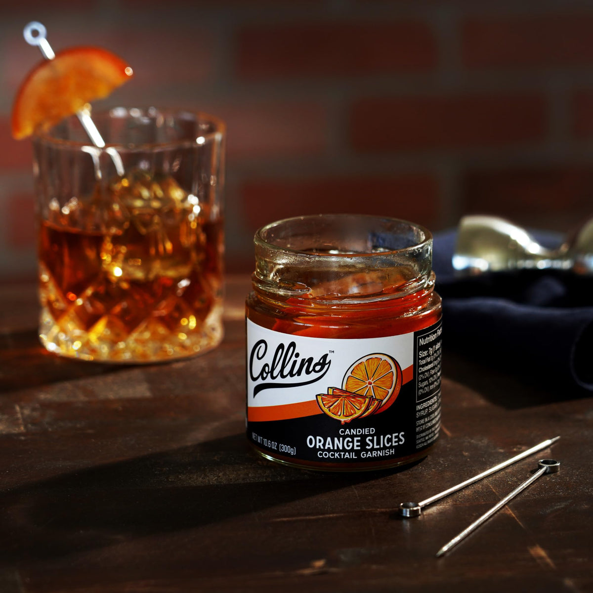 Collins Chicago home bar setup featuring orange slices garnish
