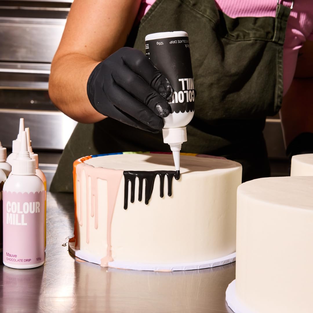 Colour Mill Chocolate Drip bottle melting in a water bath for quick prep