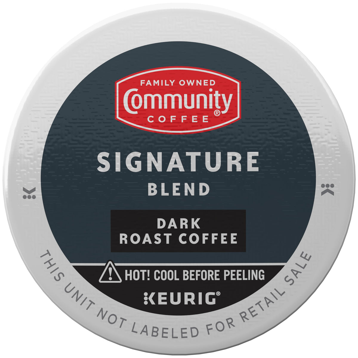 Close-up of Community Coffee Signature Blend Dark Roast pod showing bold flavor.