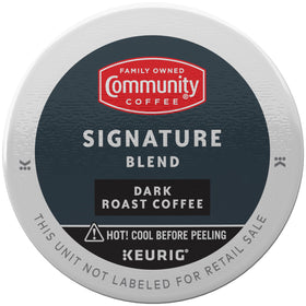 Close-up of Community Coffee Signature Blend Dark Roast pod showing bold flavor.