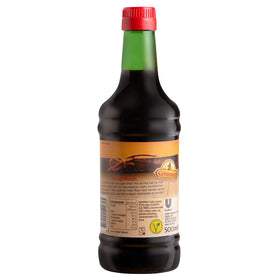 Conimex Ketjap Manis pour demonstrates a rich glaze for finishing dishes