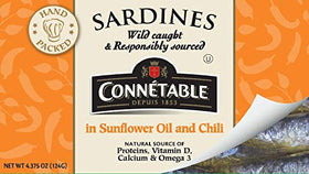 Connetable sardines in sunflower oil and chili, label close-up shows ingredients and quality.