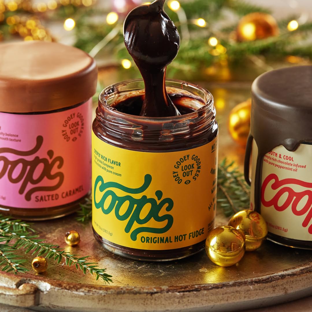 Pouring Coop's Hot Fudge from a jar for decadent desserts and drinks.