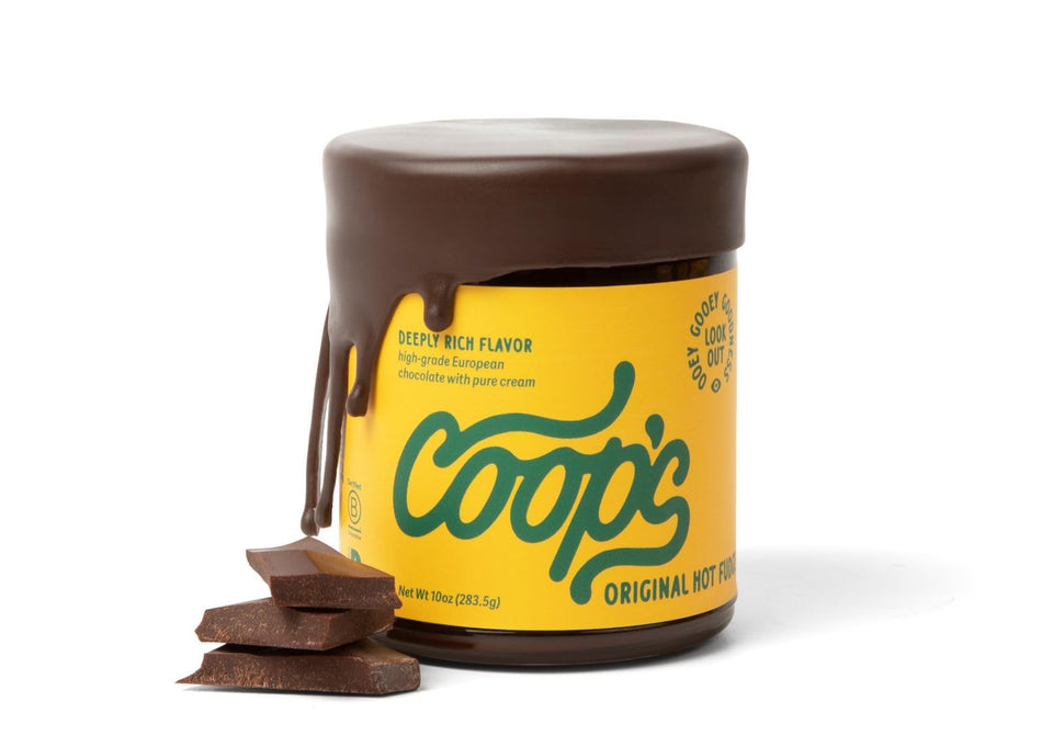 Coop's Original Hot Fudge bottle pour showing rich, velvety topping for desserts