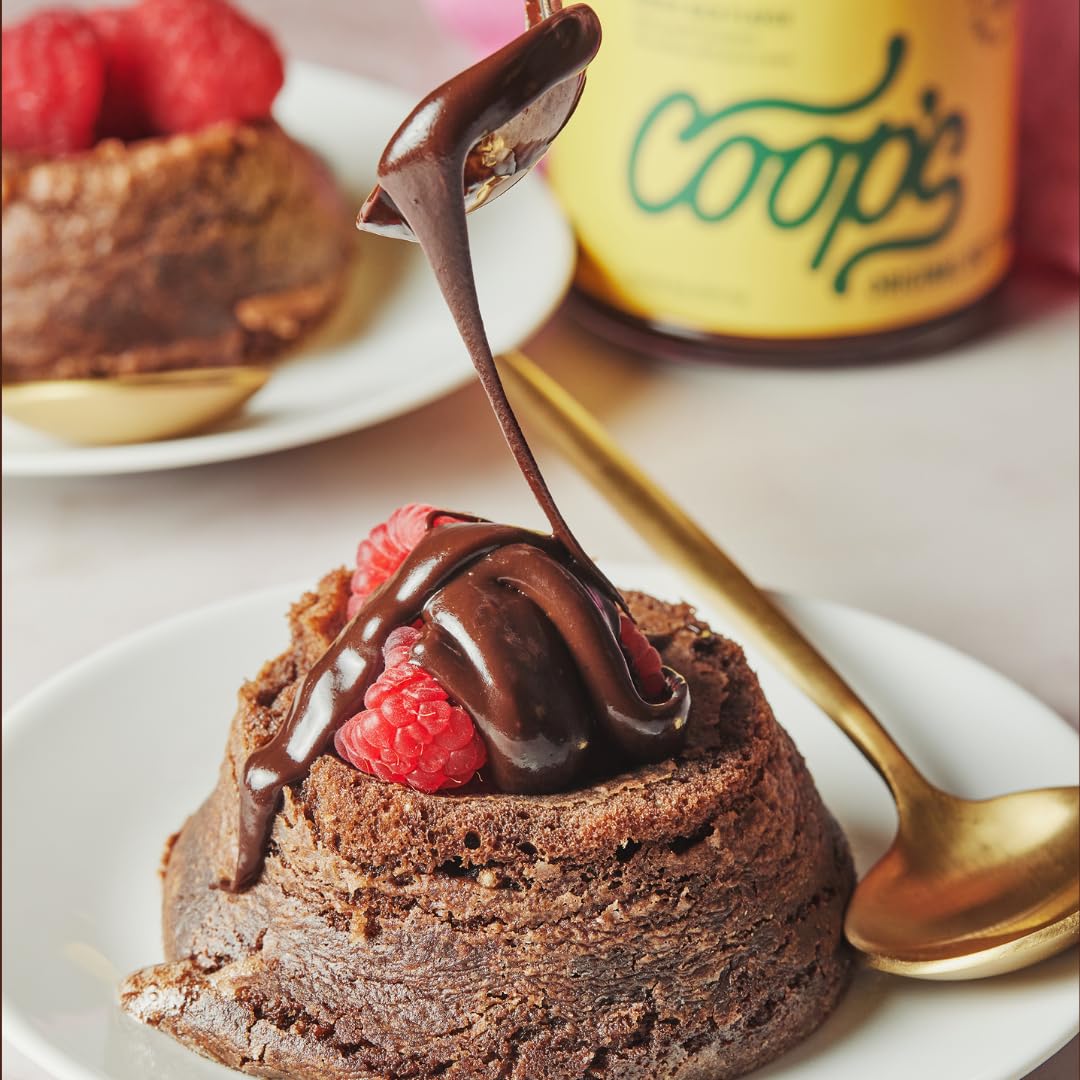 Coop's Original Hot Fudge drizzled on pancakes for indulgent breakfast