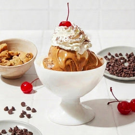 Coop's Peanut Butter Sauce swirled into smoothies for flavor boost