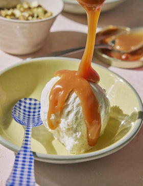 Coop's Salted Caramel Sauce drizzled into coffee for a flavor boost.