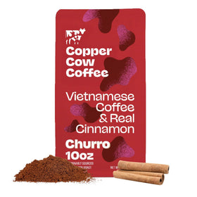 Copper Cow Coffee churro-flavored ground coffee bag with bold dark roast and real cinnamon.