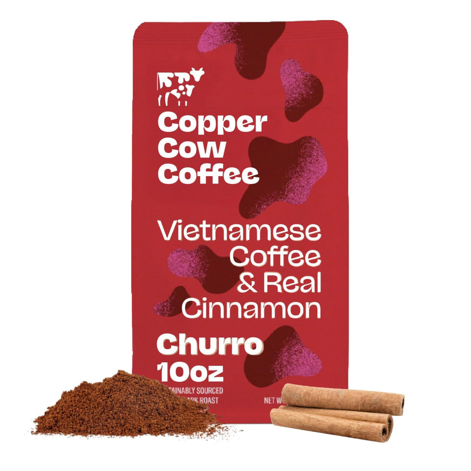 Copper Cow Coffee churro-flavored ground coffee bag with bold dark roast and real cinnamon.