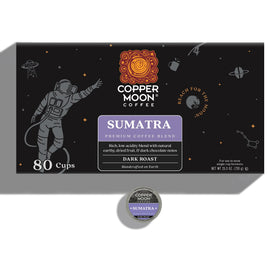 Copper Moon Sumatra packaging beside a steaming mug highlighting premium aroma