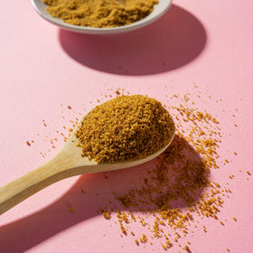 Copra Coconut Sugar with scoop ready for 1:1 substitution.