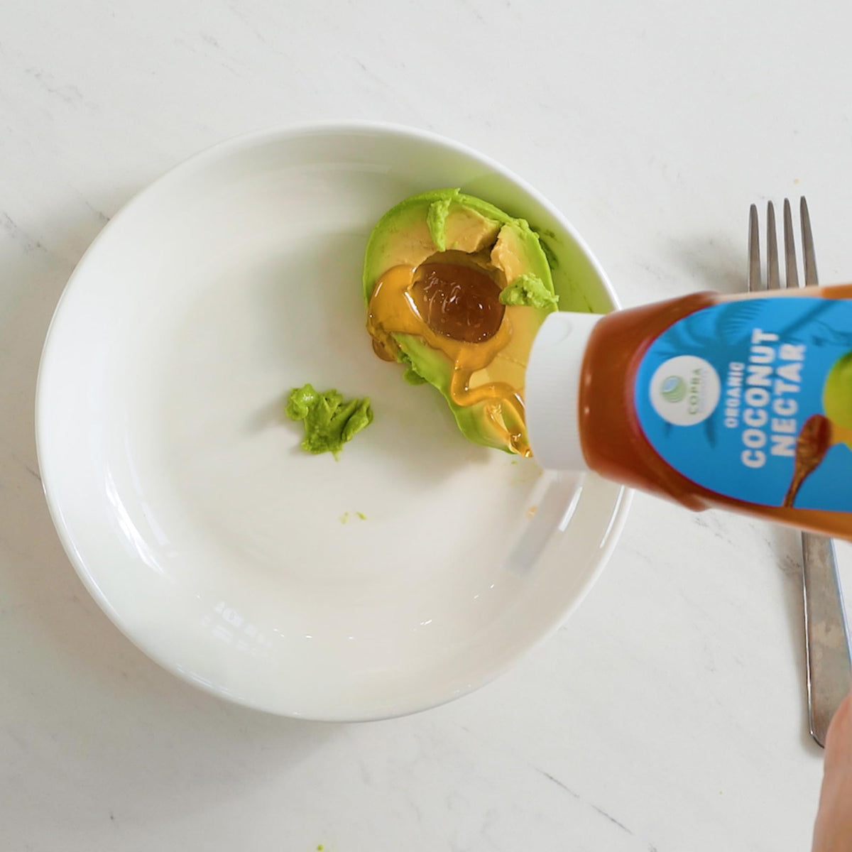 Copra Coconut Nectar label highlights organic farming and Non-GMO attributes.