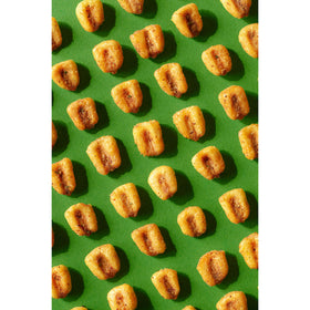 Desk or coffee table setup featuring Corn Nuts Mexican Style Street Corn for snacking