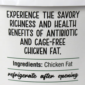 Cornhusker Kitchen pour-ready chicken fat with spoon for sauteing vegetables.