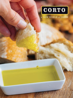 CORTO TRULY chef using oil on skillet showcases versatile cooking applications.