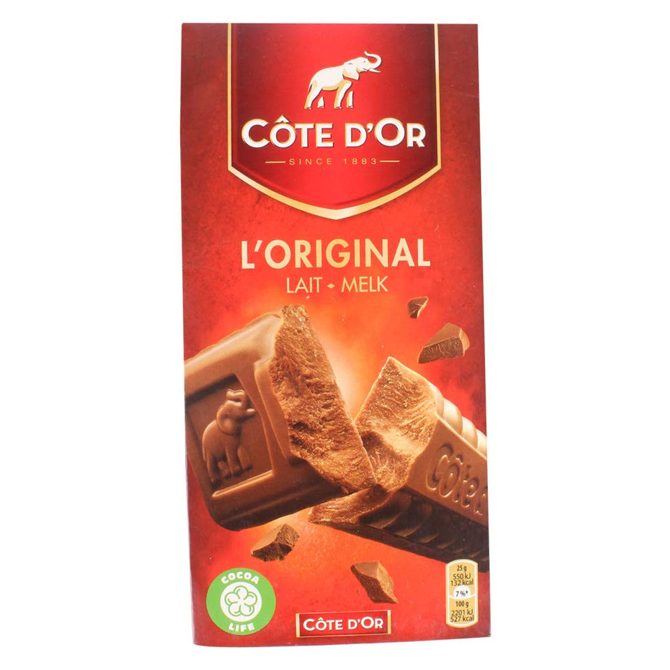 Cote d'Or milk chocolate bar packaging on desk, ideal dessert after meals.