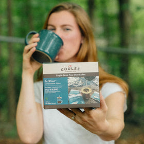 Coulée Doc's Blend compostable filter showcased in eco-friendly packaging.
