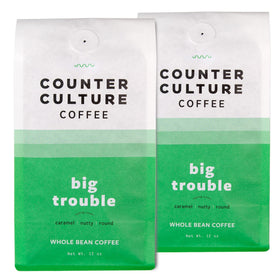 Counter Culture Big Trouble whole bean bag ready for grinding on the counter