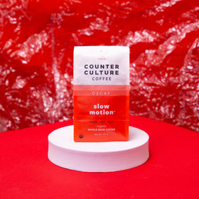 Counter Culture Slow Motion Decaf grinder-ready scene signals fresh grind before brewing.