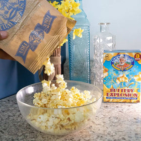 Cousin Willie's Non-GMO label on popcorn bags for ingredient transparency.
