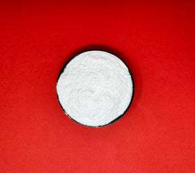 Crait Lactic Acid Powder measured for candy making and tangy treats.