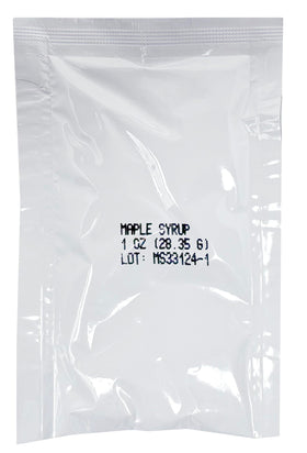 Close-up of a single-serve maple syrup packet being poured for fresh taste.