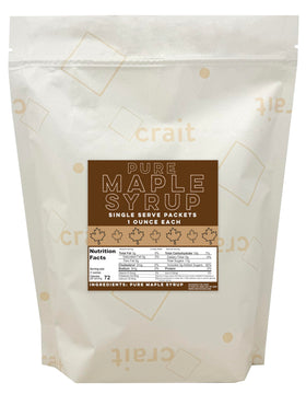 Crait 1oz maple syrup packets on a tray for easy breakfast flavor.