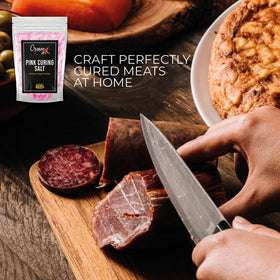 Crave Seasonings pink curing salt in-use on bacon slices for curing