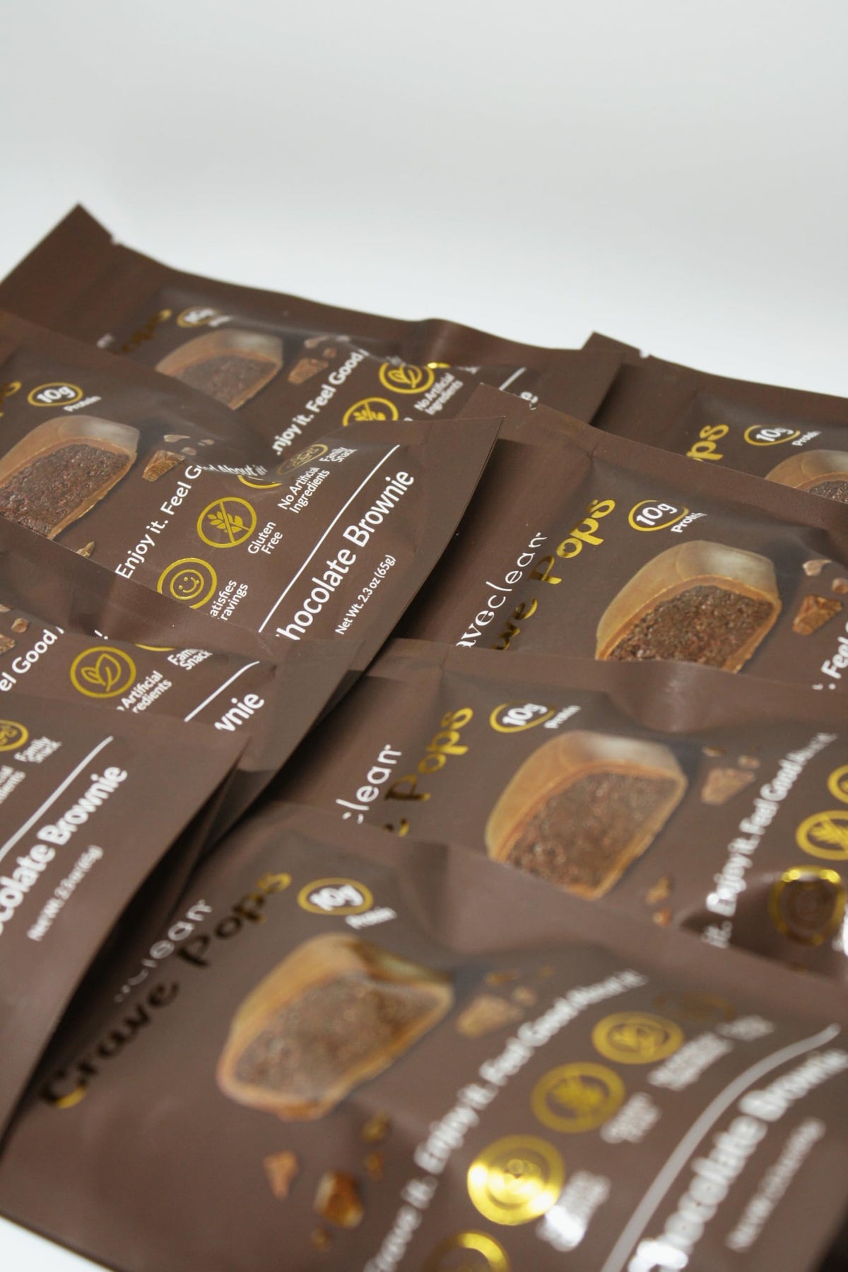 CRAVECLEAN kid-enjoying brownie pops demonstrates a parent-approved, kid-friendly snack option.