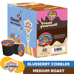 Crazy Cups blueberry cobbler pod being inserted into a Keurig-style machine for quick brew.