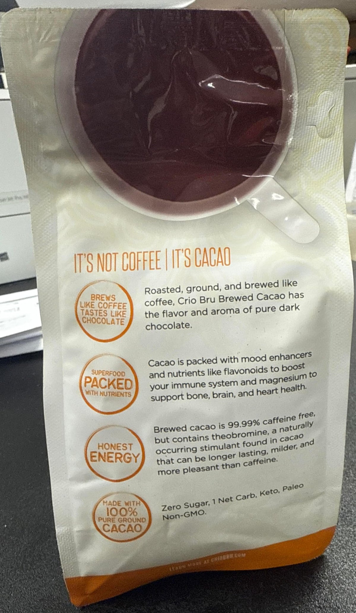 Crio Bru Brewed Cacao cup side view, smooth chocolate notes.
