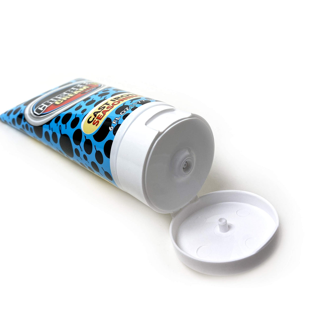 Crisbee Cream Iron seasoning on cast iron pan forms protective coating.