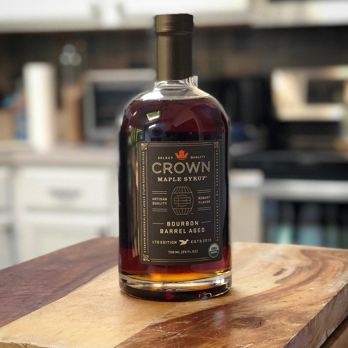 Crown Maple Bourbon Barrel-Aged syrup being poured over pancakes for brunch