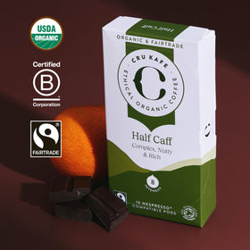 Cru Kafe organic coffee pods labeled organic, pesticide-free and Soil Association certified.