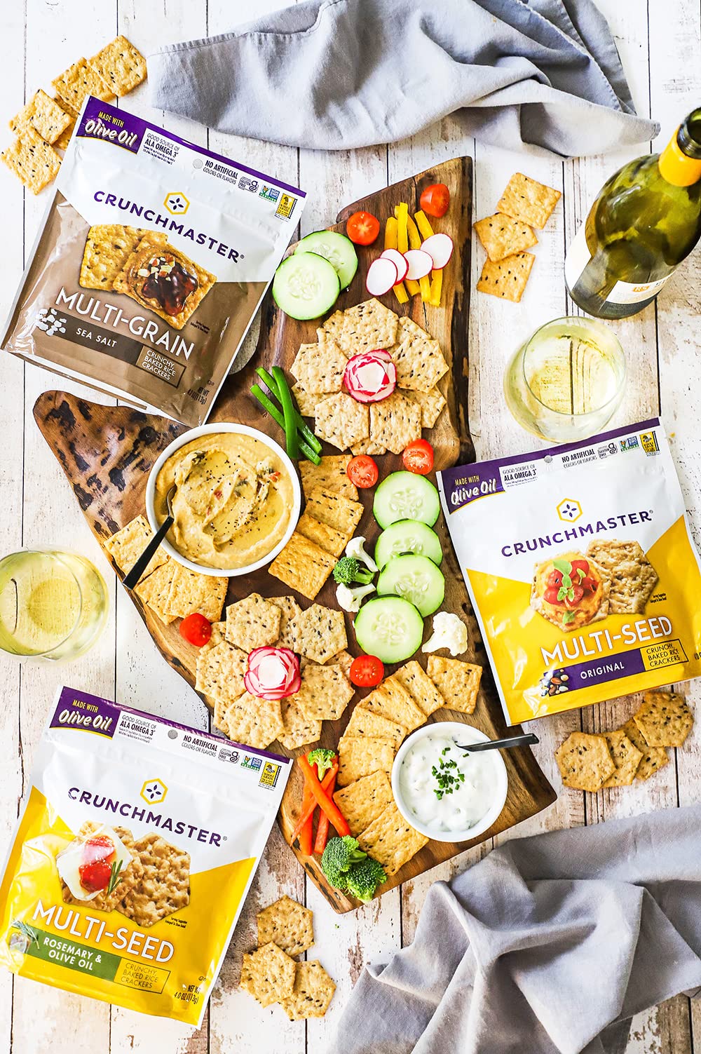 Crunchmaster gluten-free crackers served with dip demonstrates versatile pairing options.