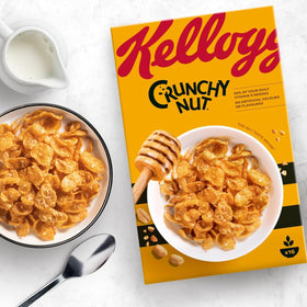 Crunchy Nut cornflakes in a bowl with milk, inviting crunch and aroma.