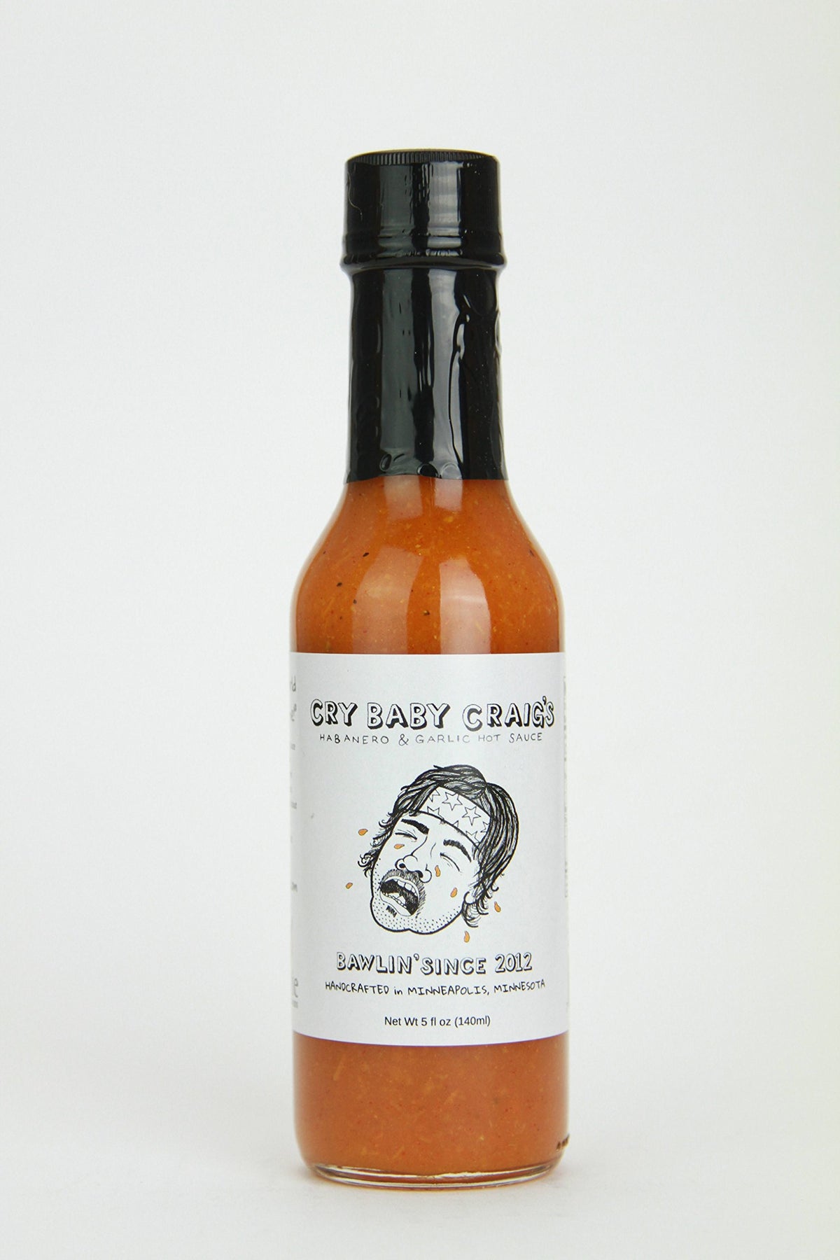 Cry Baby Craig's habanero garlic hot sauce bottle shows bright pickled heat and glossy finish