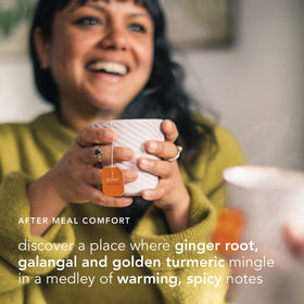 Cup of Pukka Three Ginger tea steeping with inviting warmth