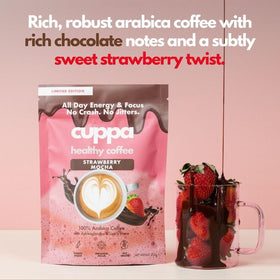Cuppa Strawberry Mocha lifestyle shot with cup on desk evokes productive routines.