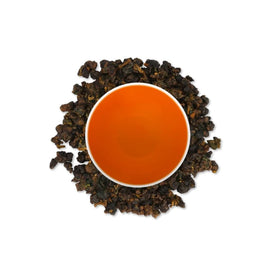 CUSHLA GABA Oolong steeping shown with cup of orange-brown infusion.