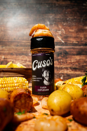 Cuso Cuts Cajun seasoning on shrimp pan for savory Cajun kick
