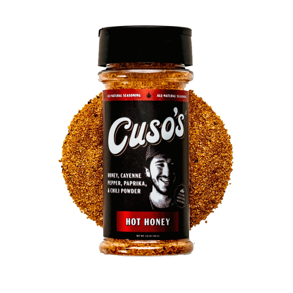 Cuso's Cuts Hot Honey BBQ rub bottle ready for grilling, boosting beef flavor.