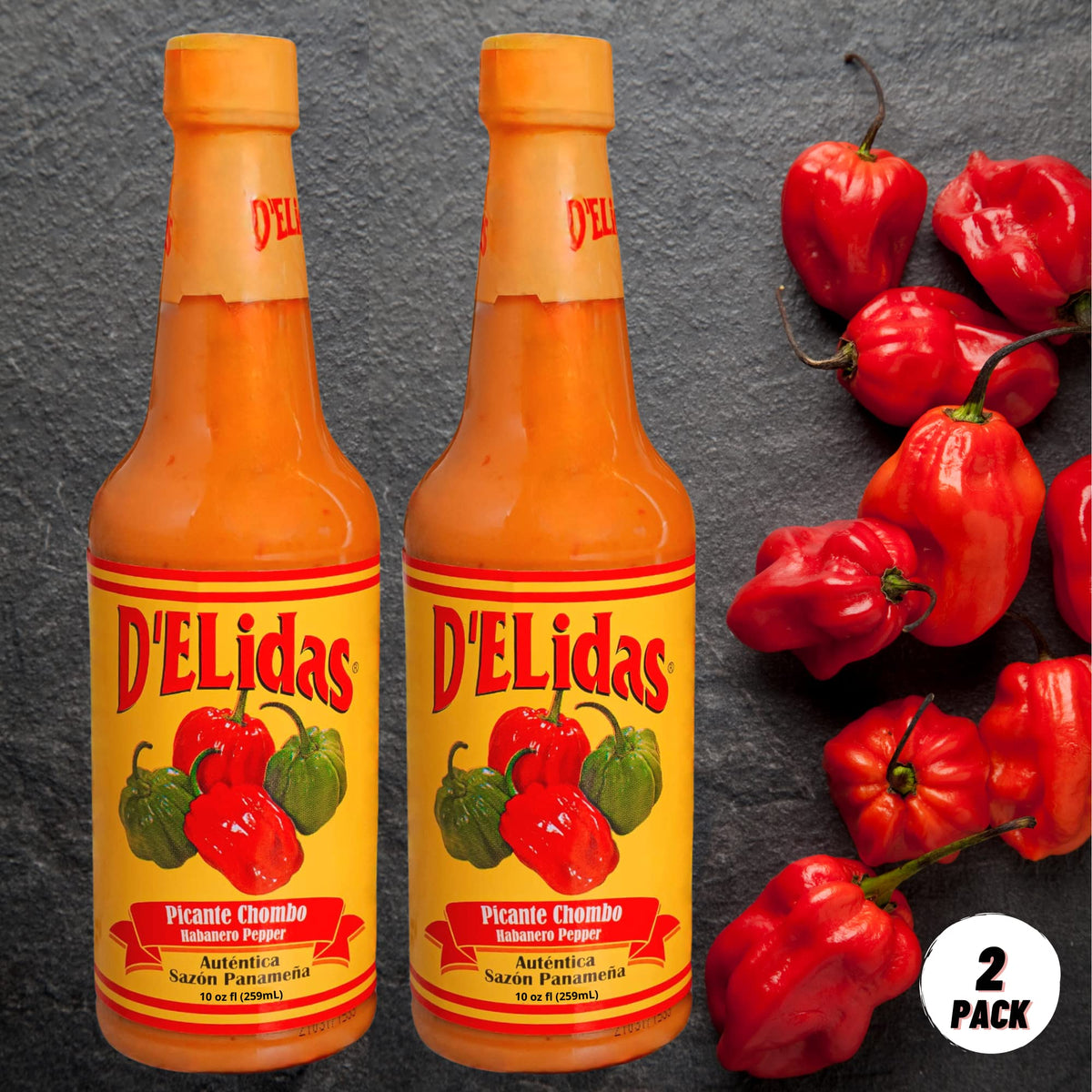 D'ELidas Habanero Hot Sauce pour shot showing vibrant color and heat.
