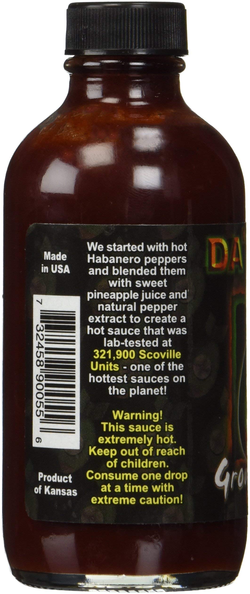Da Bomb Ground Zero bottle label close-up highlighting peppers and heat.