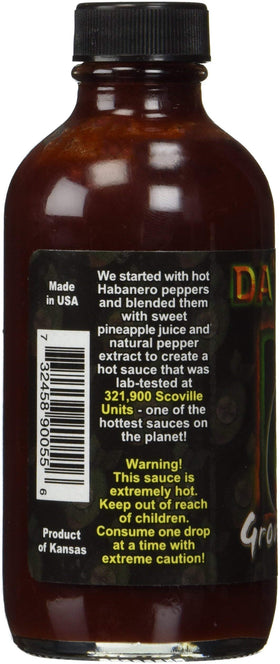 Da Bomb Ground Zero bottle label close-up highlighting peppers and heat.