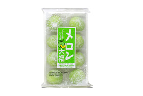 Daifuku melon mochi slice; bright fruit center and soft rice cake.