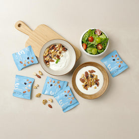 Daily Gourmet Nuts assembly lineup illustrating convenient snack options.