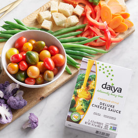 Certified vegan badge on Daiya Alfredo sauce packaging.