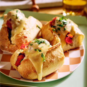 Daiya dairy-free cheddar sauce pour reveals smooth plant-based creaminess.